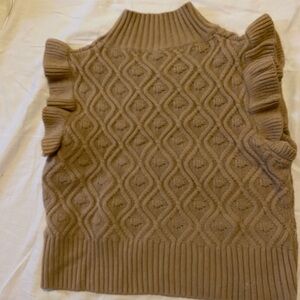 Sleeveless sweater with ruffles!